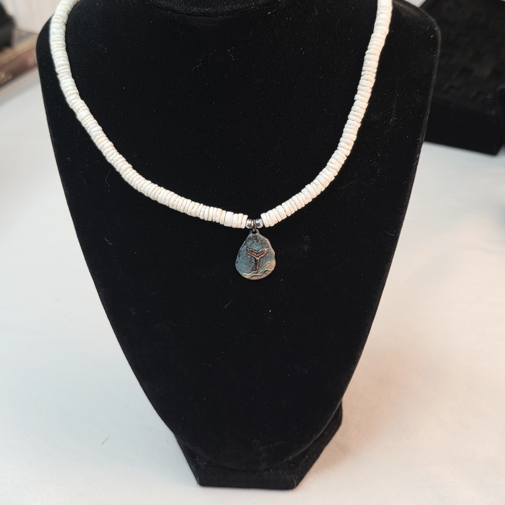 Elegant White Beaded Necklace with Silver Pendant